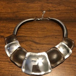Brown and silver choker type necklace.